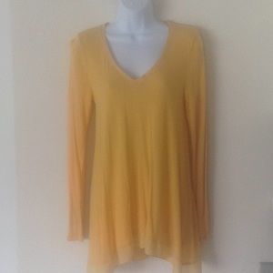 Apricot long sleeved swing tee w/sheer hem.